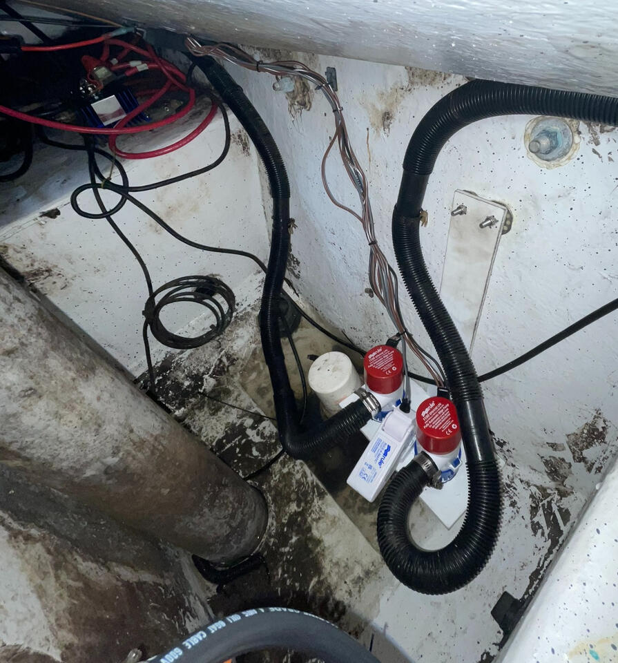 Installation of mercury triple steering power source, as well as dual bilge pumps on custom epoxy mounts, and custom height bracket