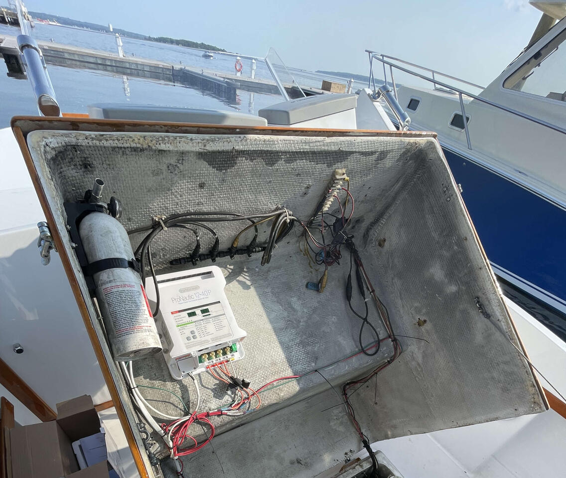ProNautic 12-40P triple battery charger installed in center console, cable ran forward for bow thruster battery located in bow locker